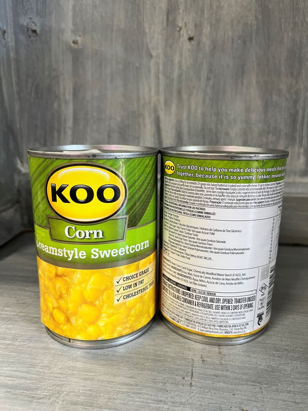 A tin of KOO Cream Style Sweetcorn, showcasing the label with bright yellow corn kernels and a creamy texture, a popular South African tinned product.