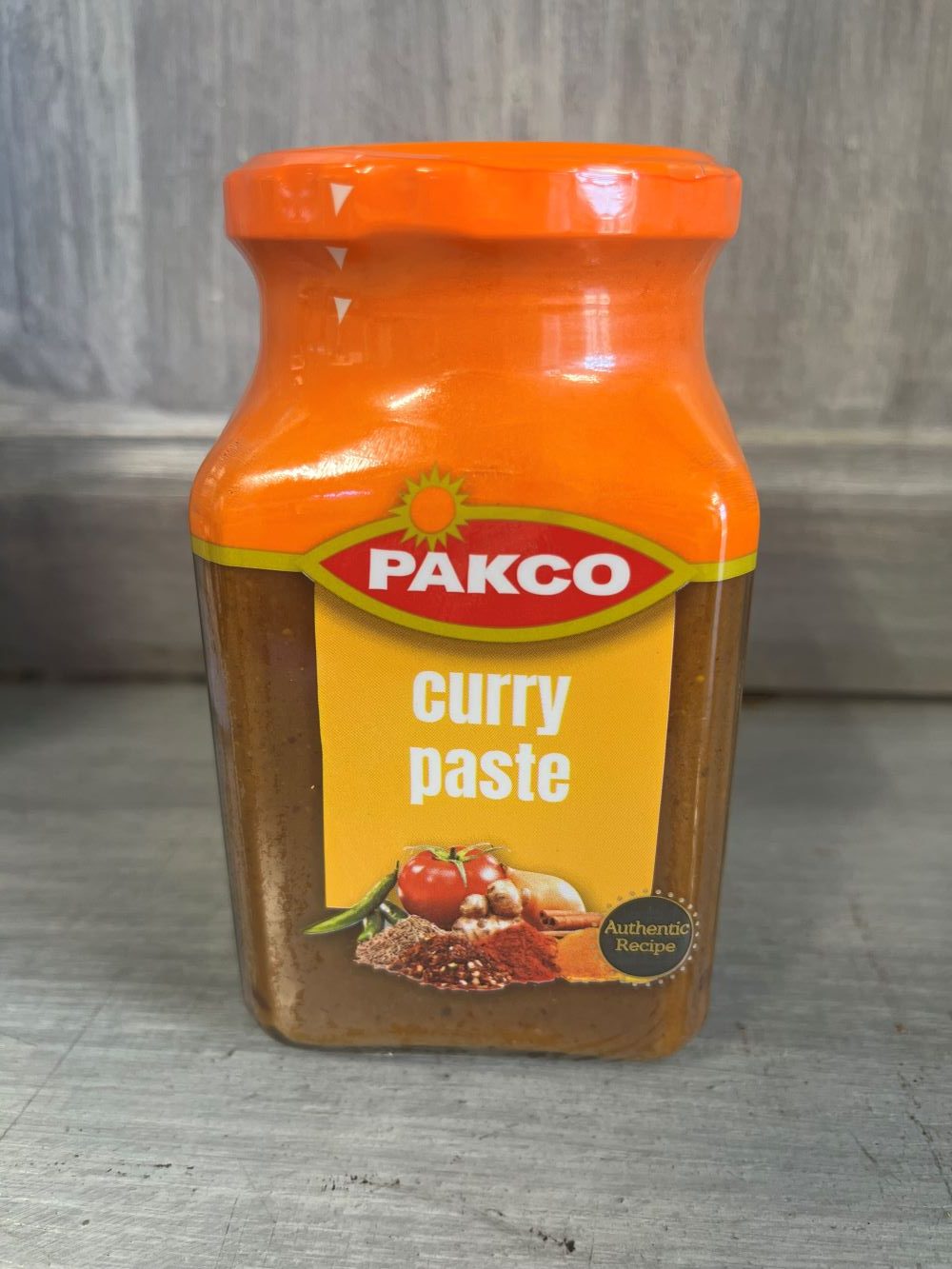 PAKCO Curry Paste jar with aromatic spices and herbs.